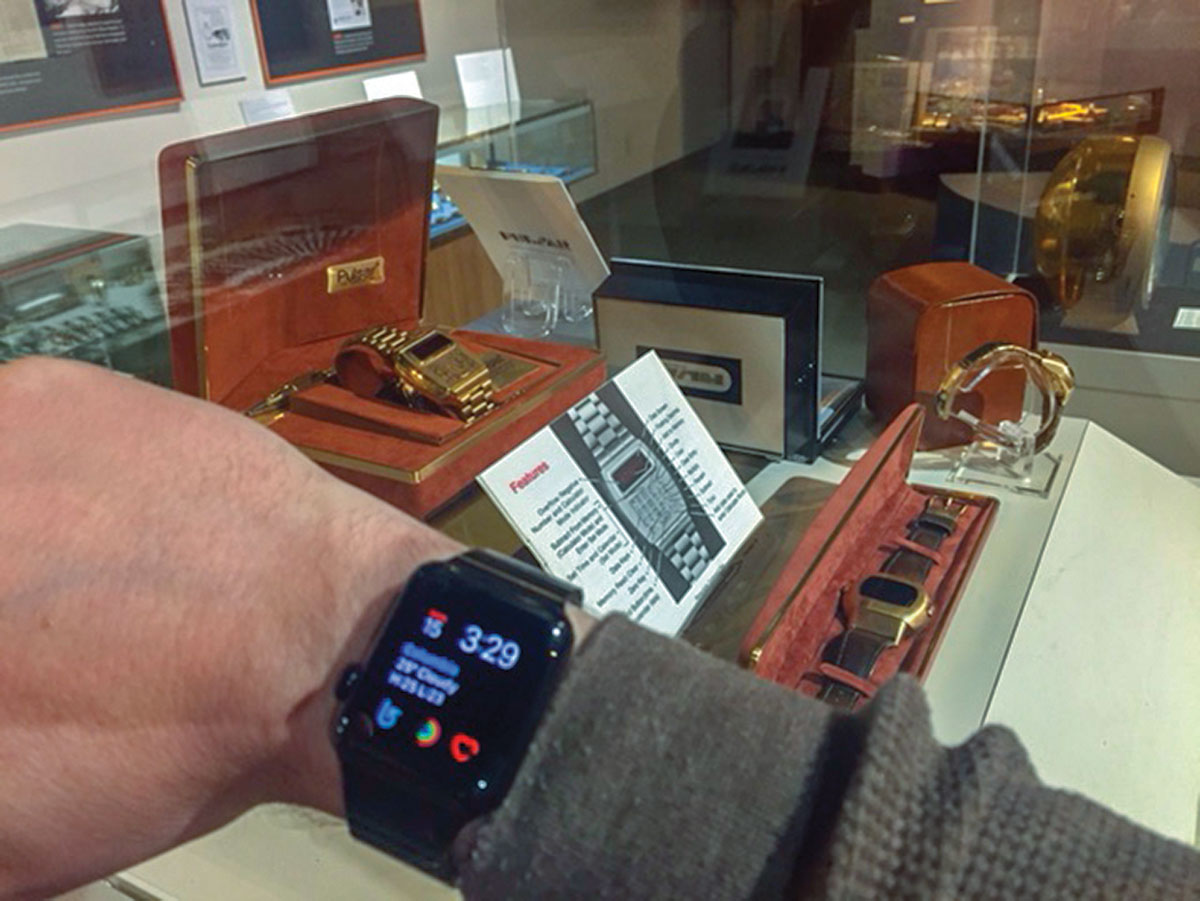 First Generation Apple Watch with hourglasses in background at the National Watch & Clock Museum.
