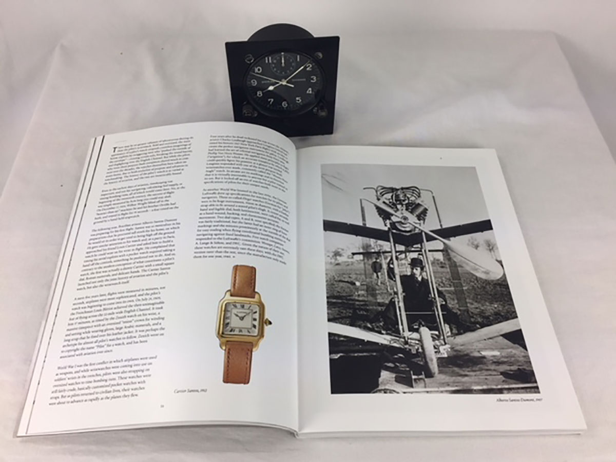 Two-page spread of Jack Forster’s “A Personal Universe,” with an astrolabe from the National Watch & Clock Museum