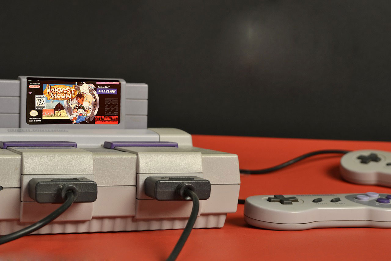 North American SNES with Harvest Moon game cartridge
