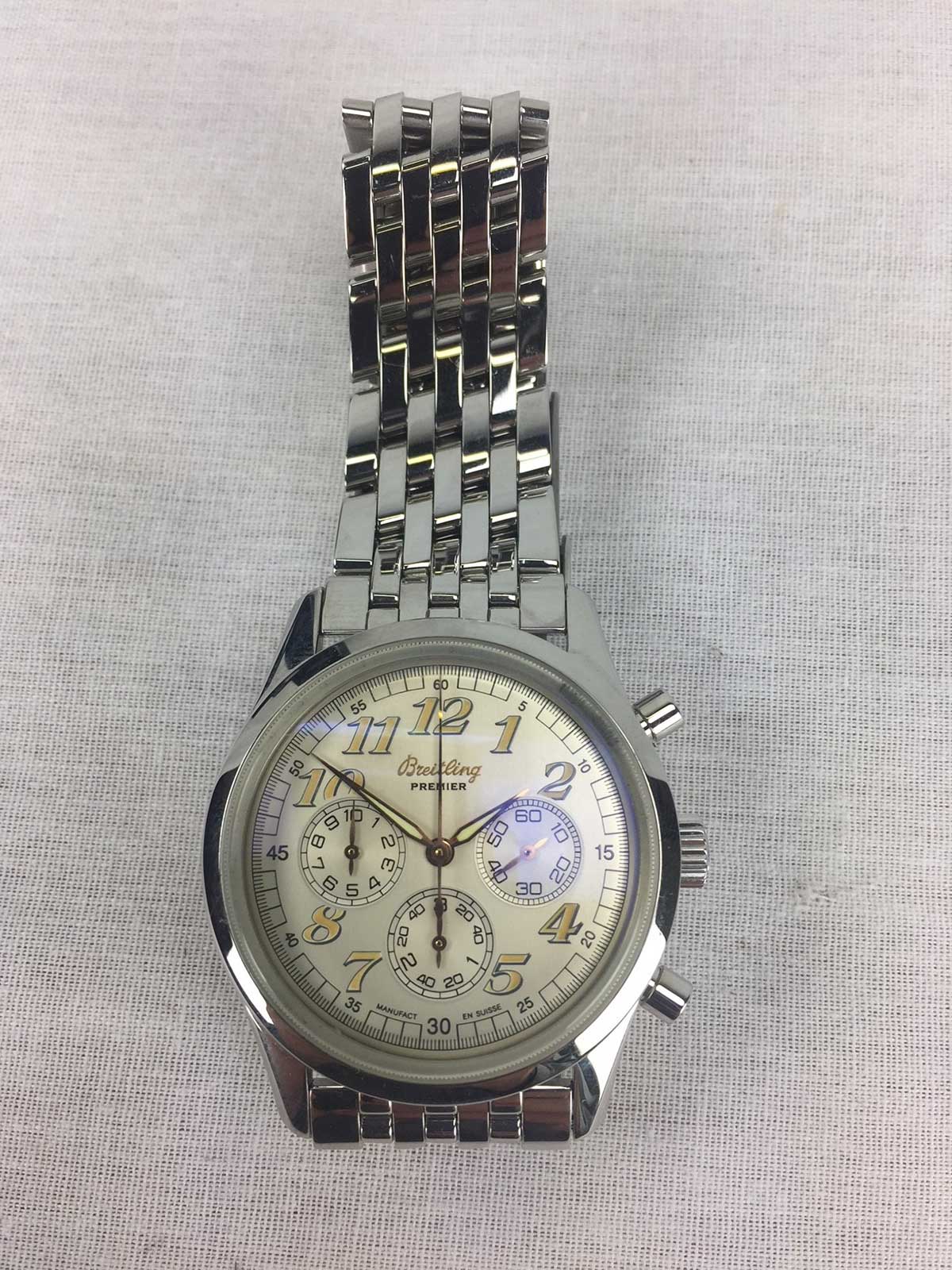 Premier Breitling wristwatch with a silver dial, aviation numerals and a steel bracelet