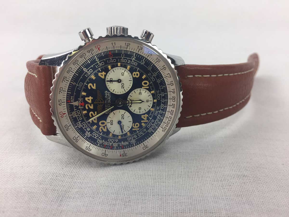 Cosmonaute II Breitling wristwatch with a blue dial, silver zones and a brown leather strap
