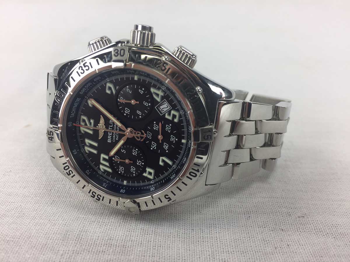Chronoracer Rattrapante Breitling wristwatch with a black dial, aviation numerals, and steel bracelet