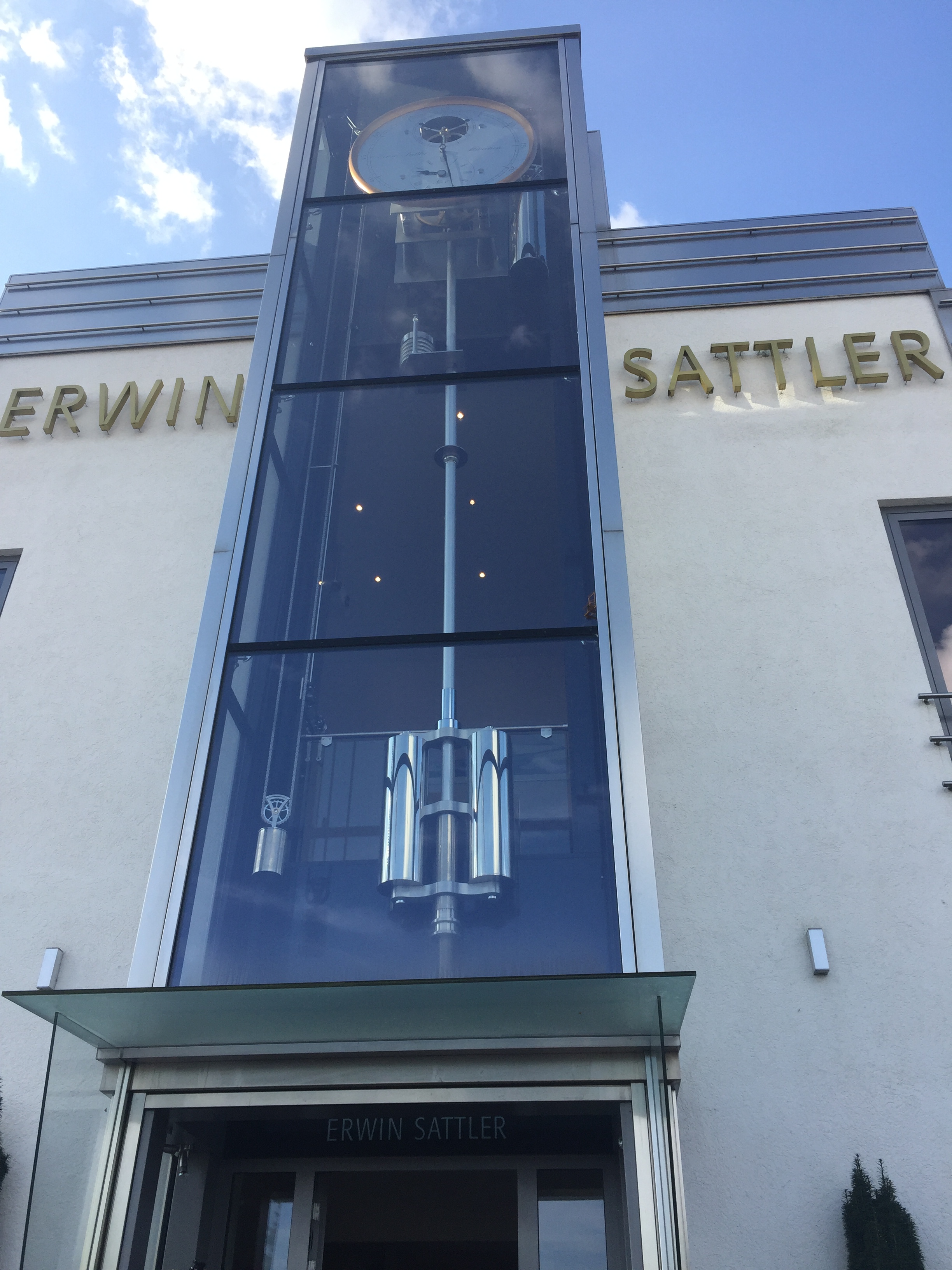 The world’s largest working regulator hanging over the front entrance of the Erwin Sattler manufactory in Munich