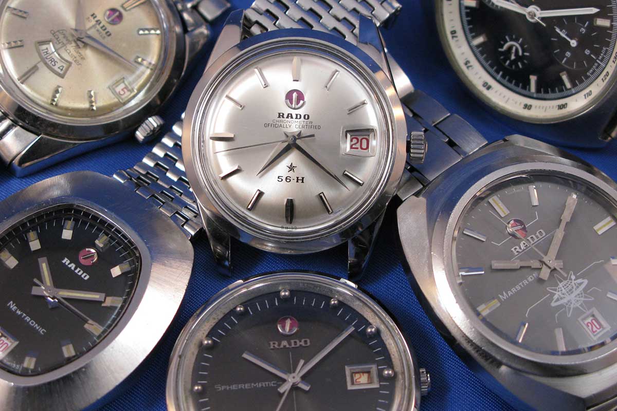 six artistically arranged steel-cased Rado wristwatches