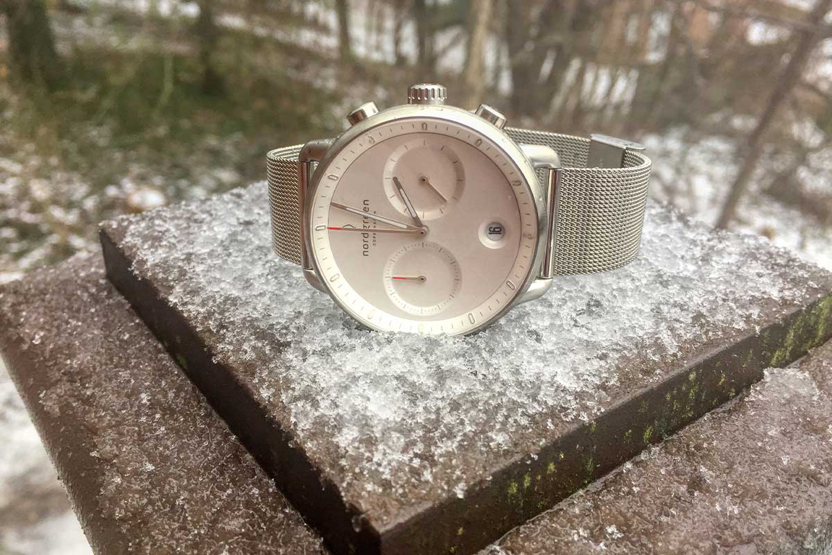 Nordgreen Pioneer chronograph lying in snow