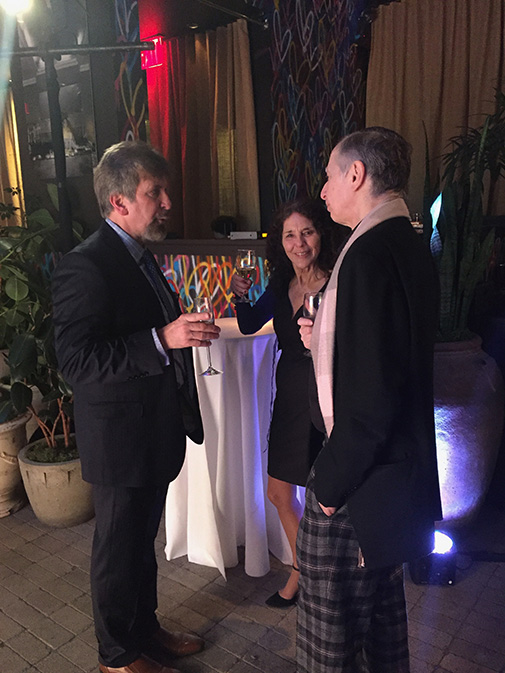 Cheers! Tom Wilcox, Executive Director of the National Association of Watch & Clock Collectors Inc., chatting with two attendees at the event